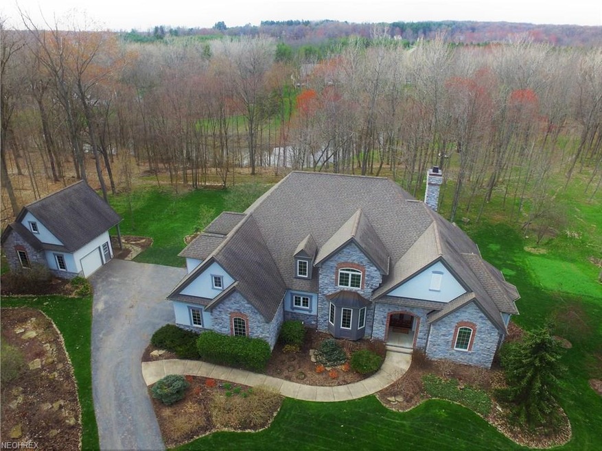 Aerial view of the front of the home, carriage hou