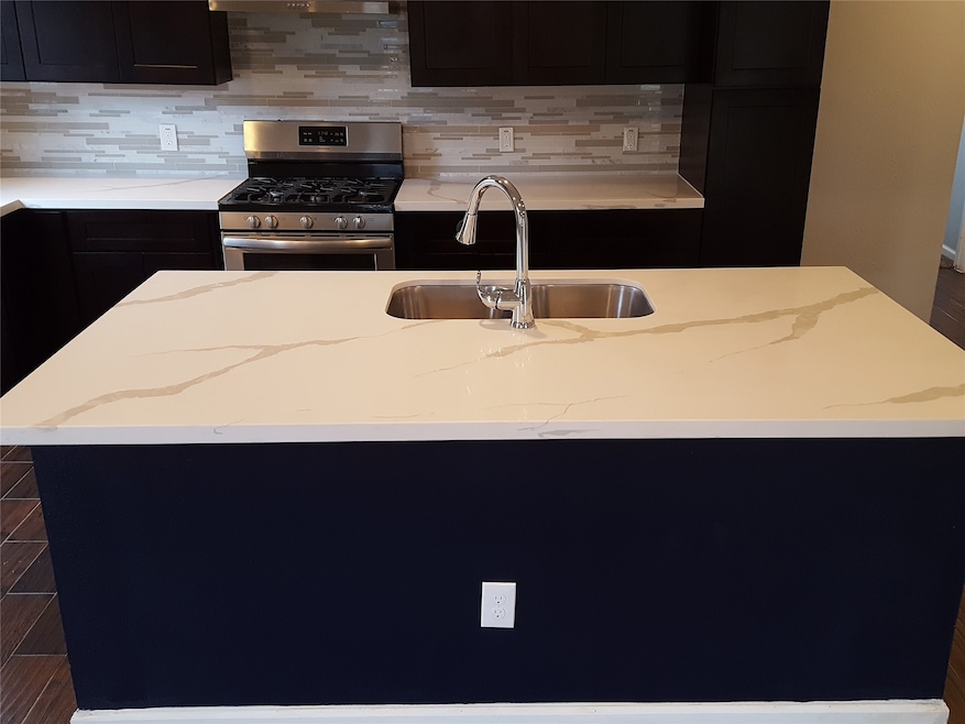 Great view of the kitchen - Huge Granite Center Island - Stainless Steel Appliance, Backsplash, Rich Custom Cabinets