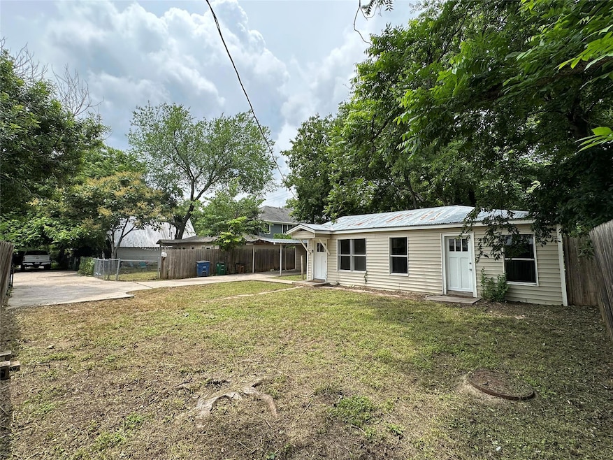 View of yard with concrete driveway