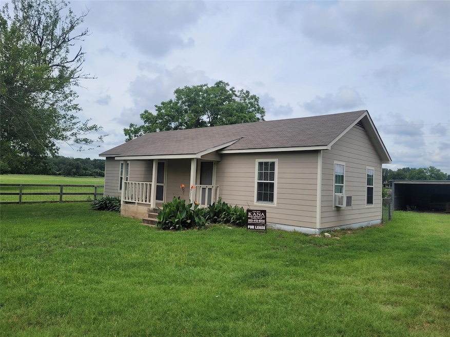 View of front of home with covered porch and a sh