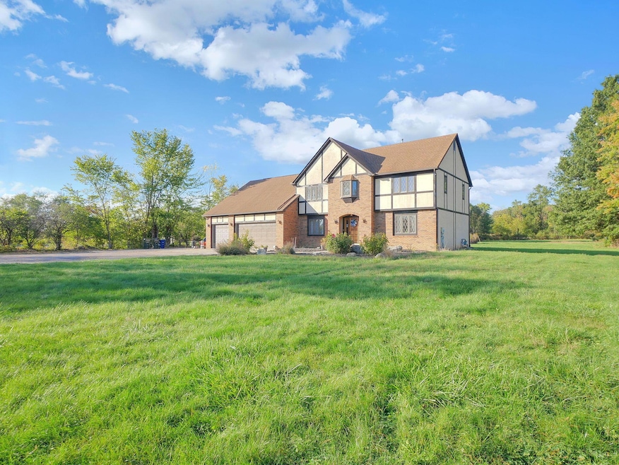 Front of the home with a huge front yard.