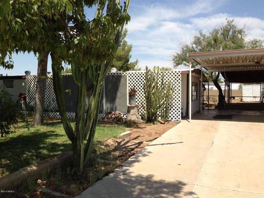 front of mobile home and carport