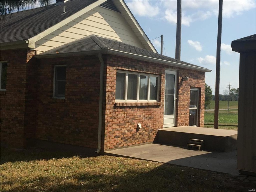 Rear two door entry.  Door at bottom of stairs leads to lower level but also accesses laundry.  Upper level door enters direct to laundry.