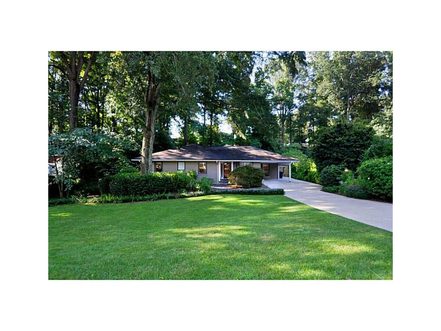 Exterior Front. Beautifully landscaped yard