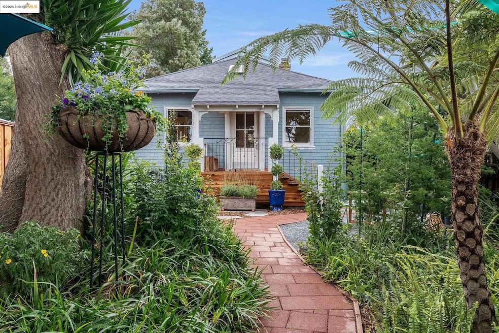View of front of house featuring a shingled roof