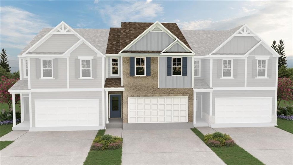 View of front of house featuring an attached garage, board and batten siding, concrete driveway, and brick siding