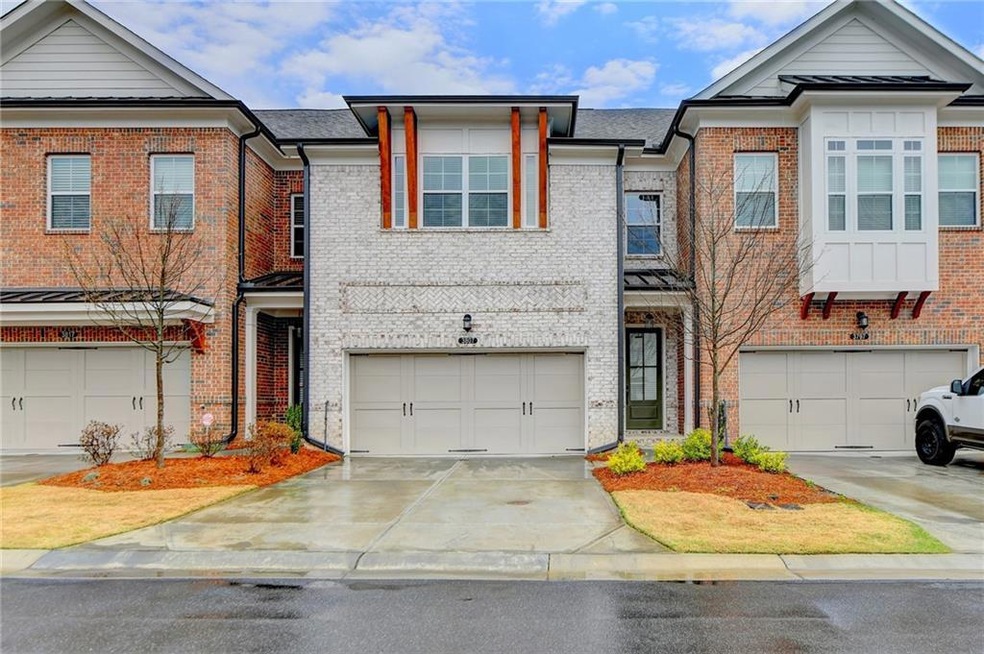 Townhome / multi-family property with a garage