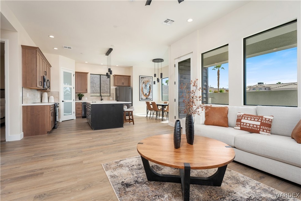 Living room with sink and light hardwood / wood-st