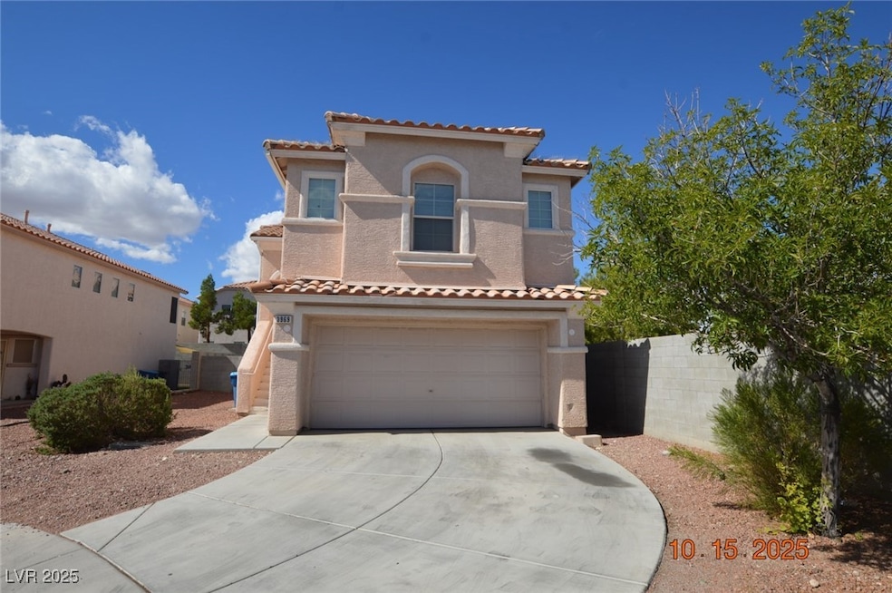 Mediterranean / spanish home featuring driveway, stucco siding, a garage, and a tiled roof