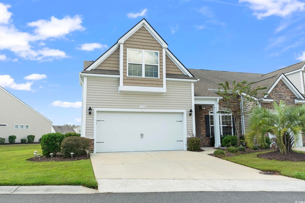 View of front of house with a garage and a front l