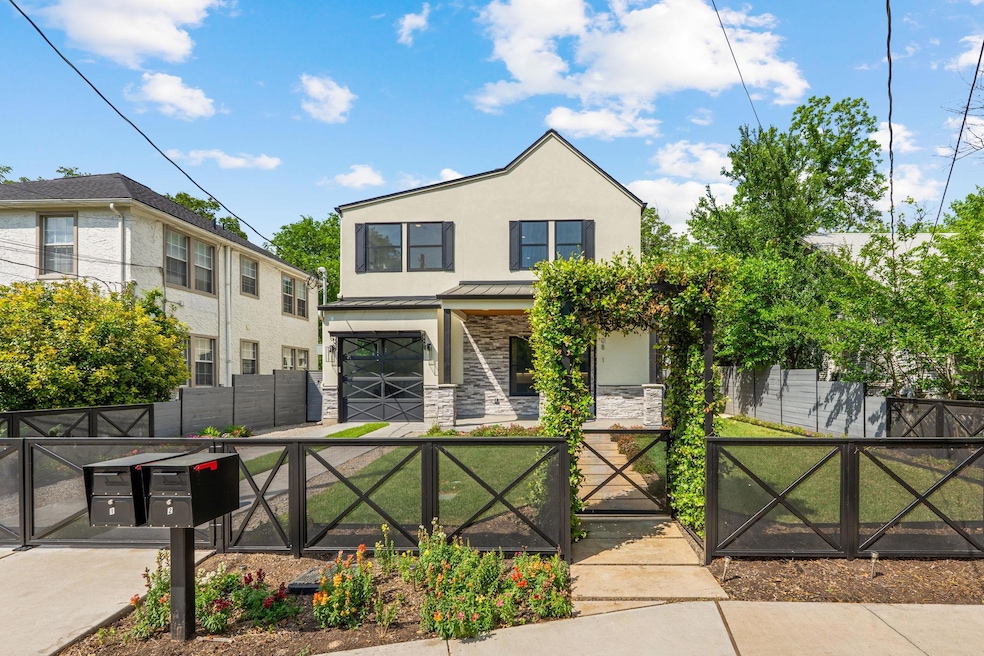 View of front of property featuring a gate, stone