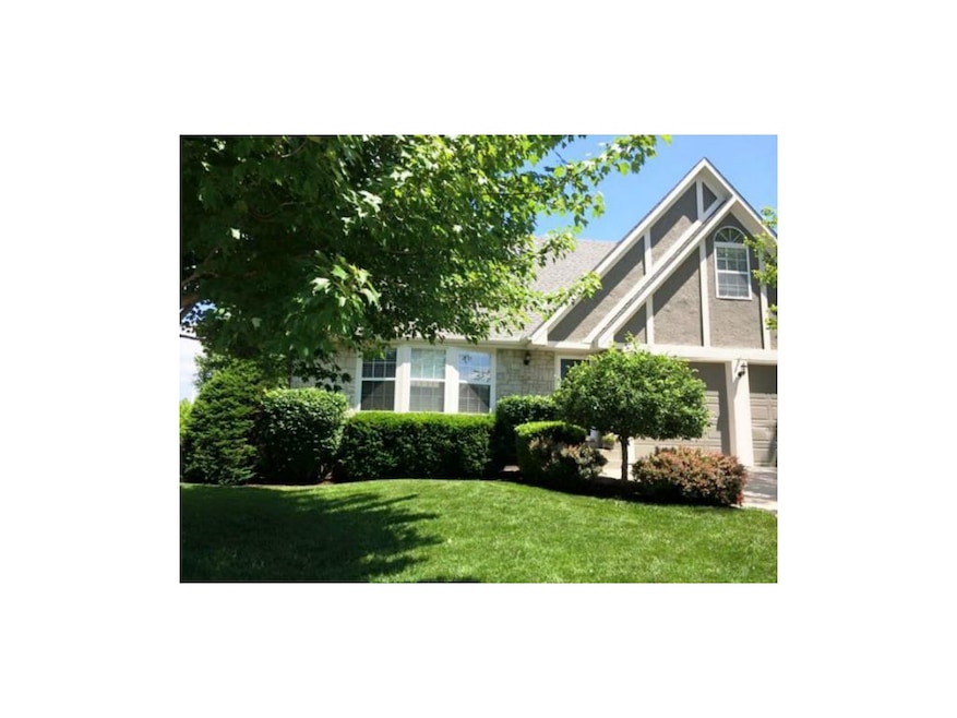 Front Exterior during Spring 14.  Upgraded Landsca