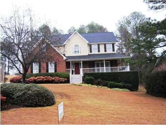 Exterior Front. Three sides brick