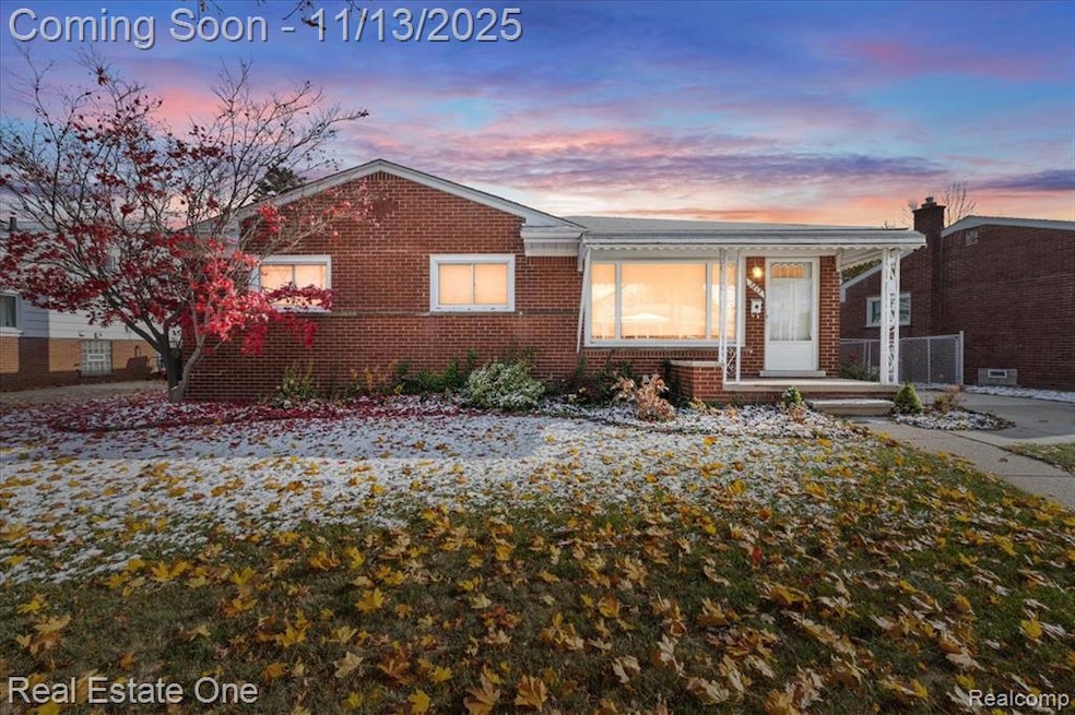 View of front facade with brick siding and a porch