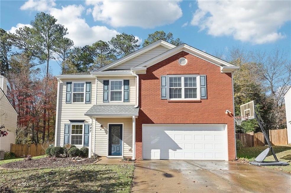 View of front property featuring a garage and cent