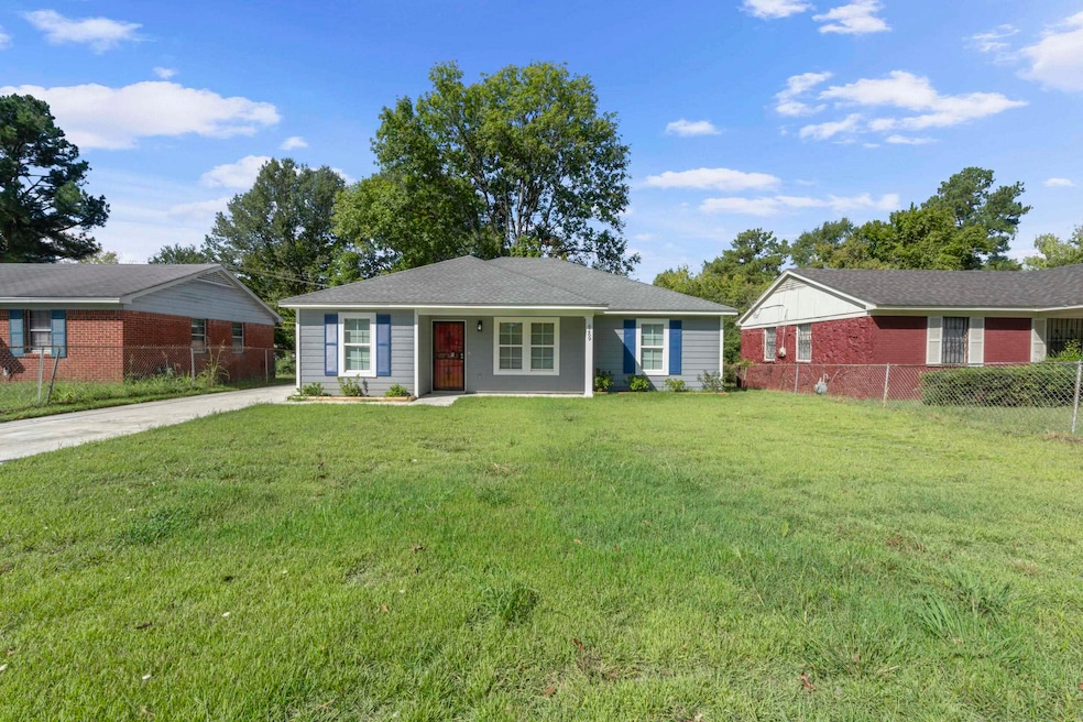 Ranch-style home with covered porch and concrete driveway