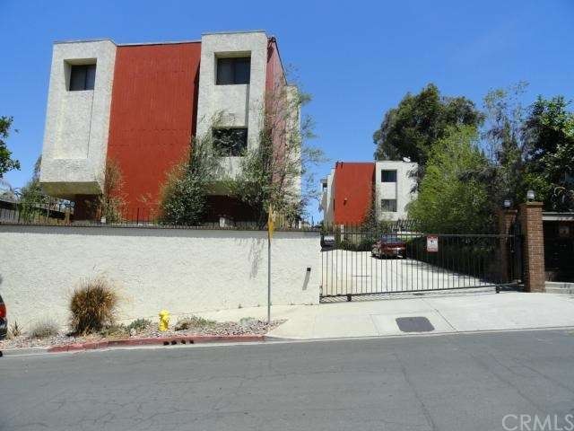 Gated entry and pedestrian gate on 20th Street