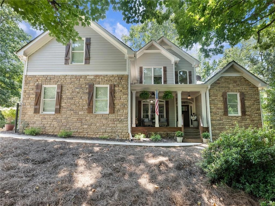 Craftsman-style home with covered porch and stone siding