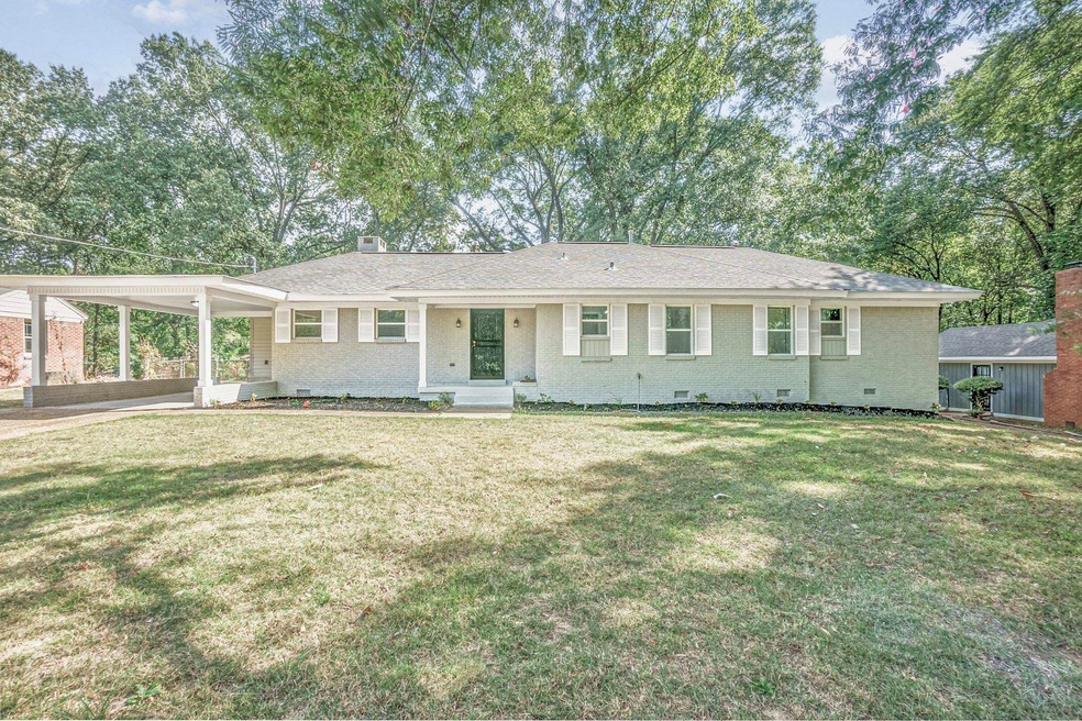 View of front of property featuring a front lawn