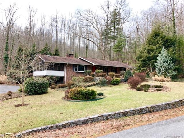The front of the home, fabulous stone walls and mature landscaping.