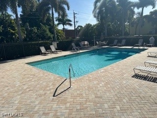 Community pool with a patio area