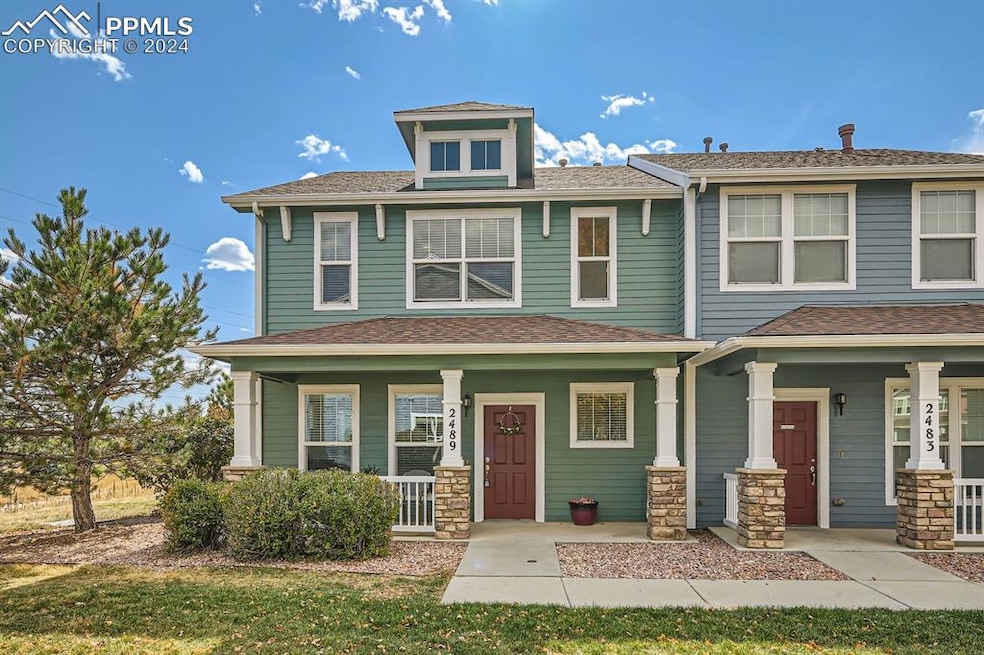 View of front of home featuring a porch and a fron