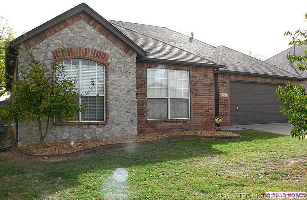 One story full brick with stone accents