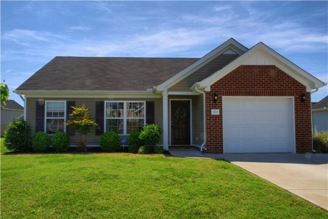 Welcome home to 611 Easy Goer Way in Belmont subdivision. Extra concrete to the right gives plenty of space to park.   