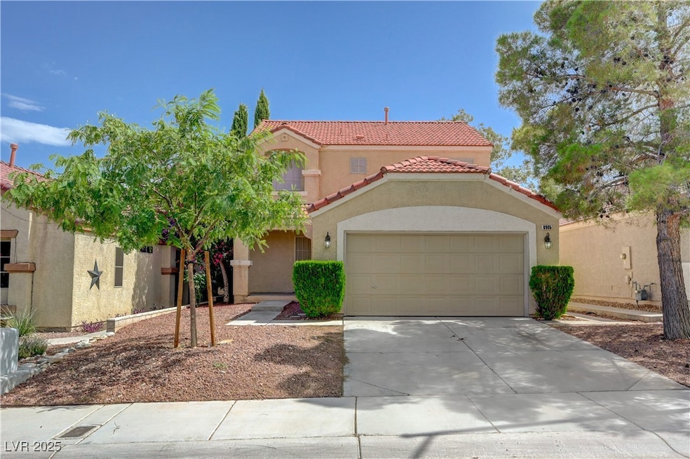 Mediterranean / spanish-style house featuring a ti