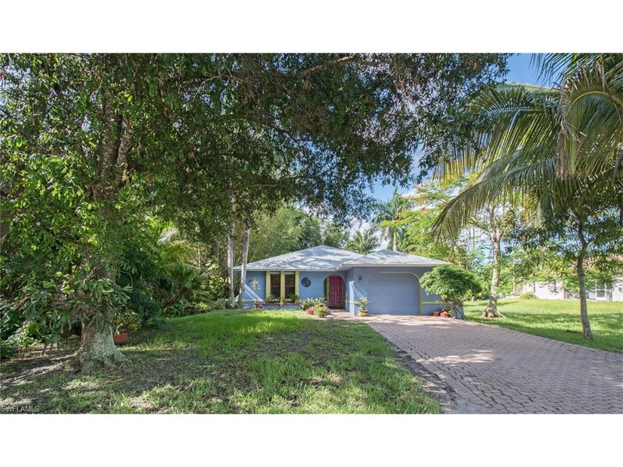 Paver driveway, mature landscaping and lots of cha