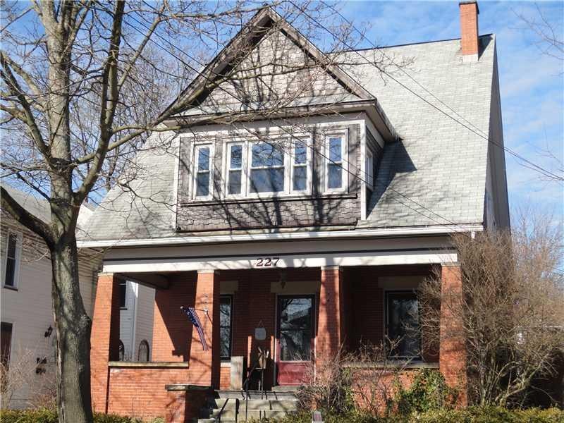 Exterior Front. Arts & Crafts home w/natural woods