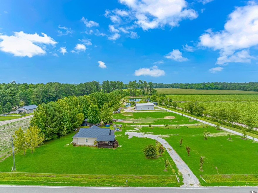 Elevated road view of the horse farmette on Magnol