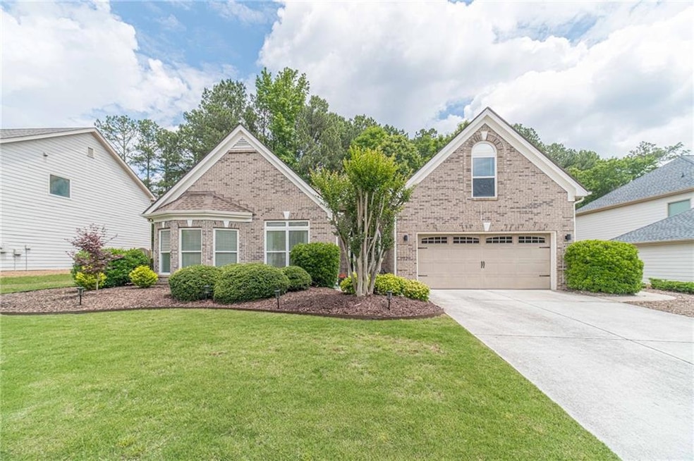 Traditional home featuring brick siding, a front l