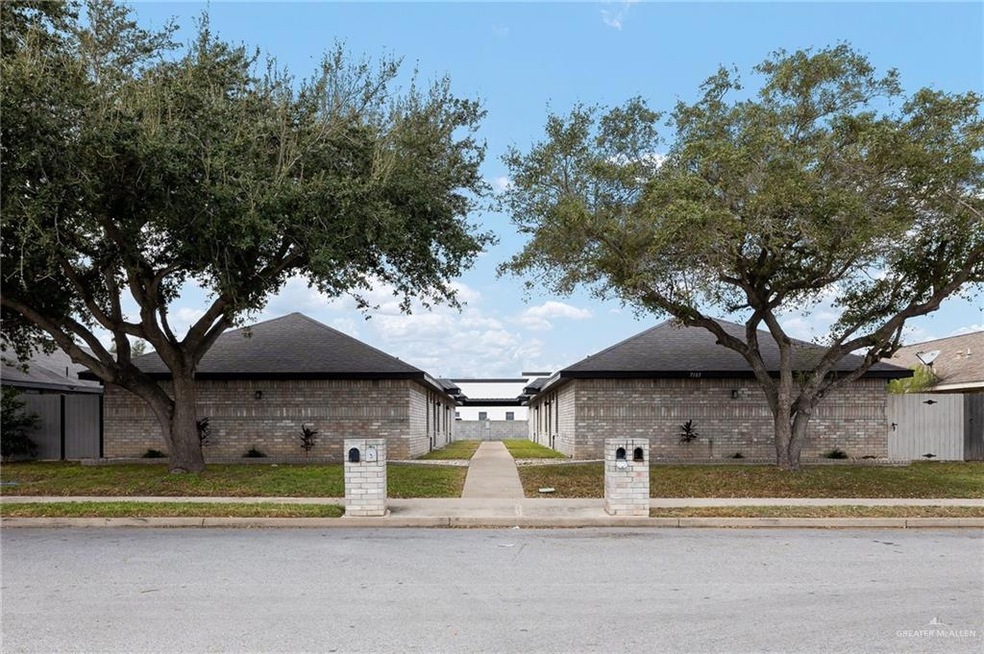 View of property exterior featuring a lawn