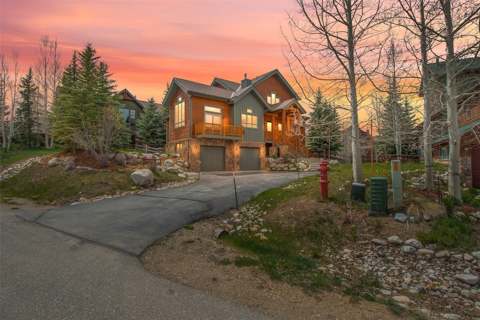 Chalet / cabin featuring an attached garage, aspha
