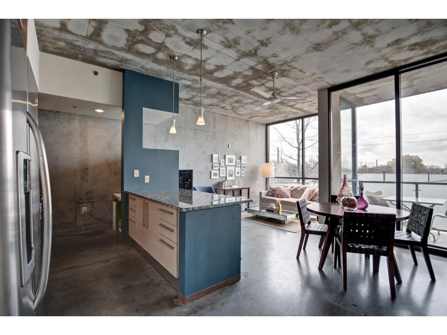 Open living and dining space with floor to ceiling