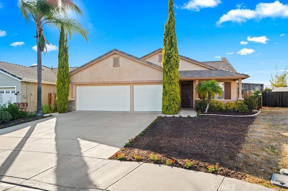 Front of Home with 3 car garage and low maintenance landscaping