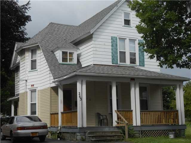 Exterior Front. New vinyl siding on lower half and