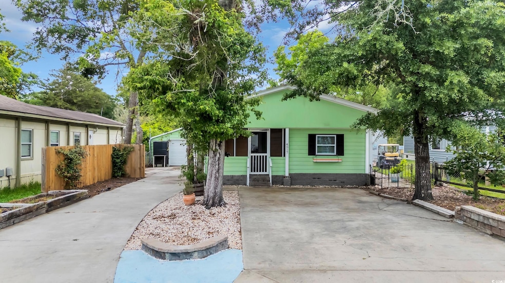 View of front of property with concrete driveway