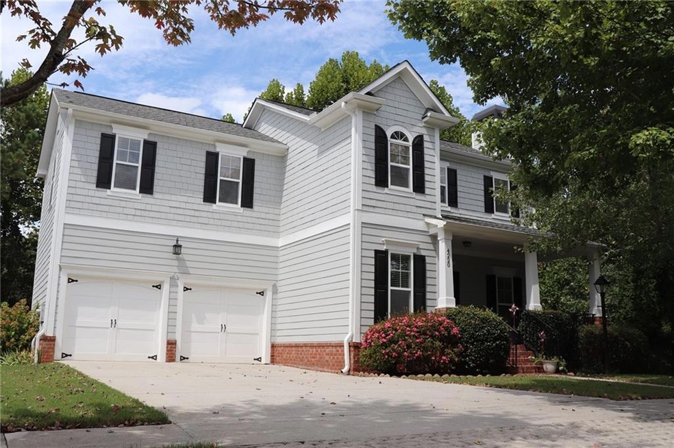 View of front of property featuring a garage