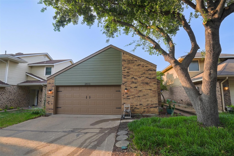 Beautiful curb appeal. New lighting, garage door &