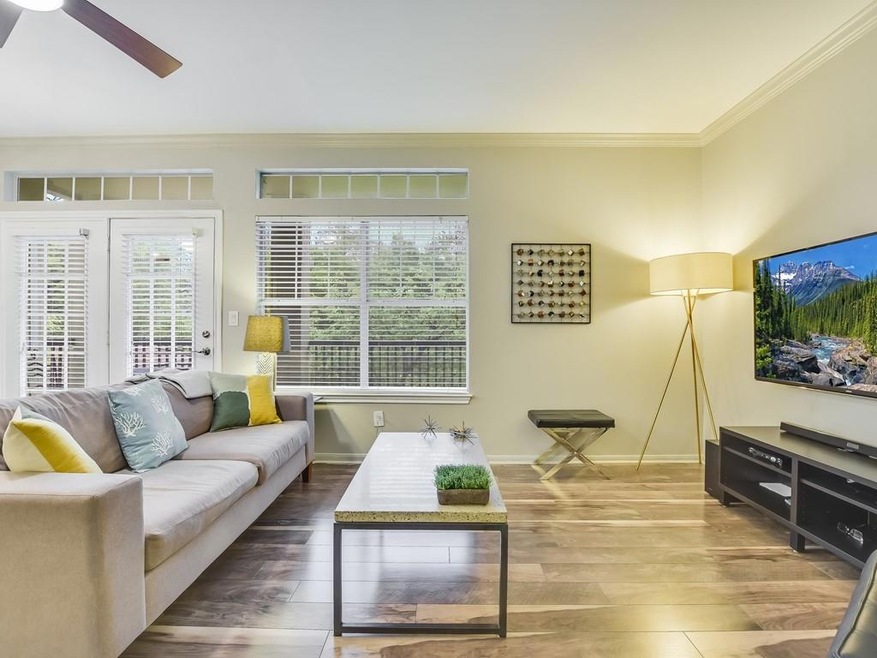This modernized 2nd-floor condo offers a front and