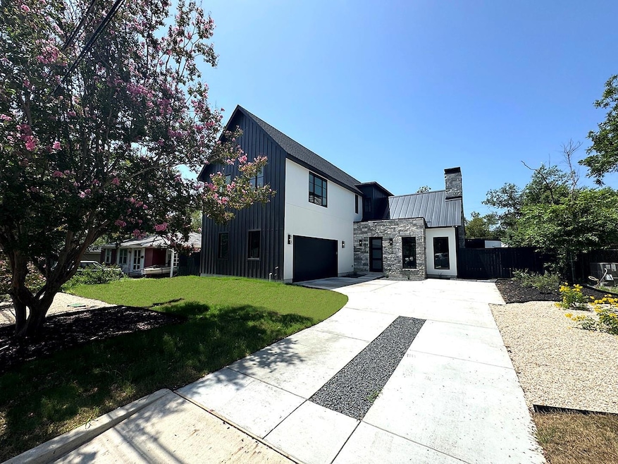 Modern inspired farmhouse featuring an attached g