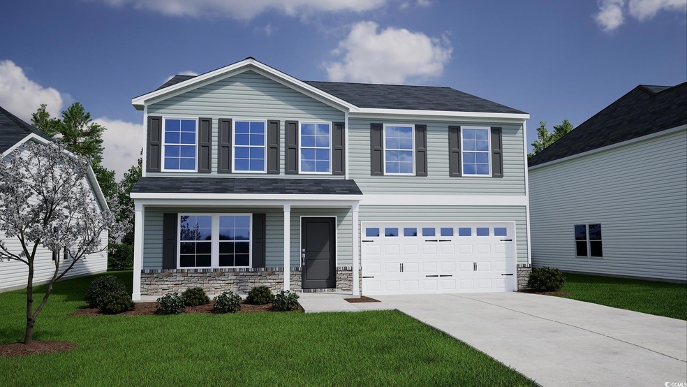 View of front of house with driveway, a front yard