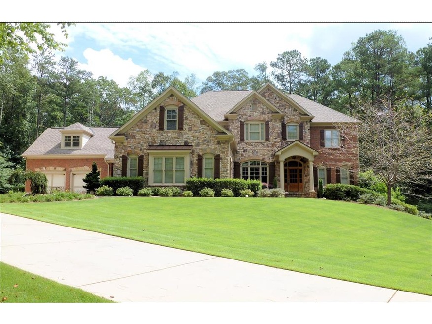 Beautiful stone and brick along with Tudor-arch wi