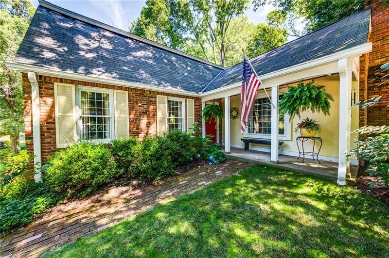 Brick walkway to charming front porch