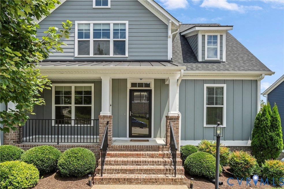 View of front of house featuring board and batten siding, a porch, and roof with shingles