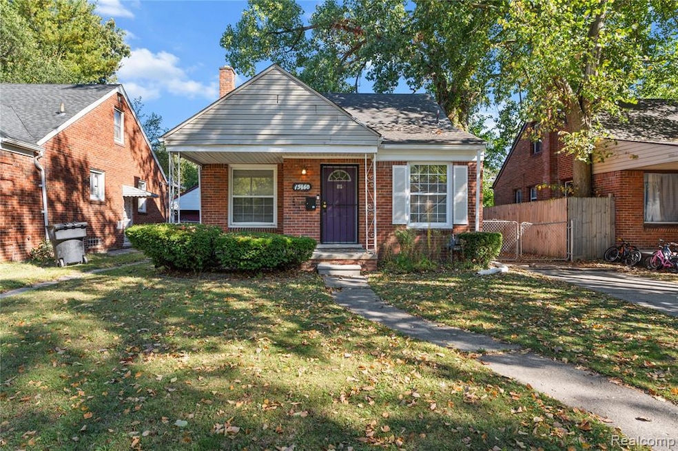 Bungalow-style home with brick siding, a chimney, and a porch