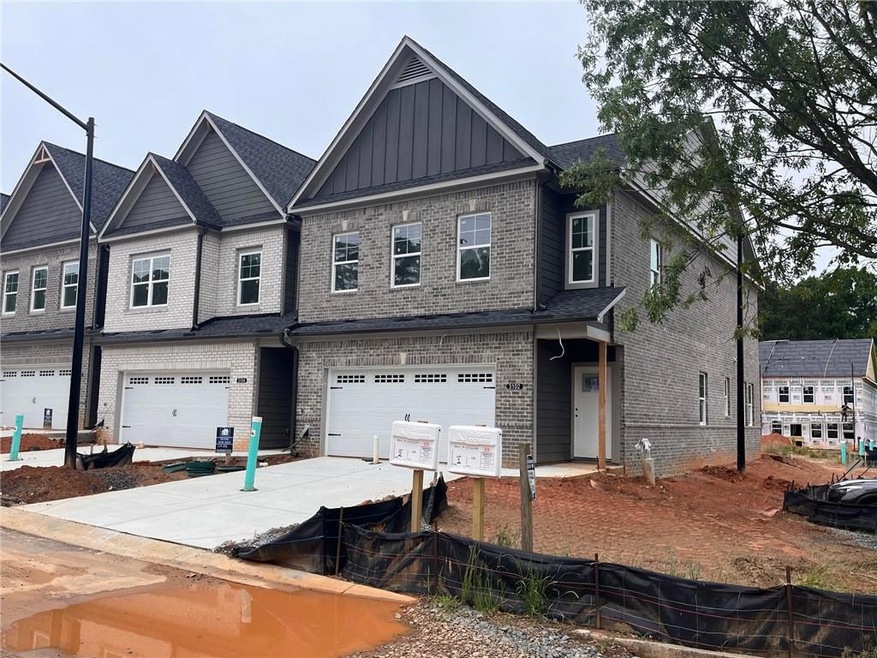 Ele D front of home.  Luxurious 4 sides brick.  End unit.  Building of 4 homes.
