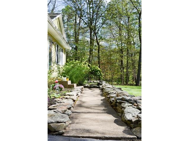 Front entry walkway with established plantings.
